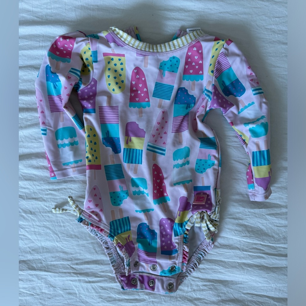 12-18 mo rash guard with snap closure crotch.  Very gently used